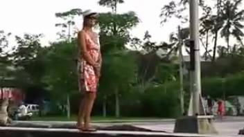 Lady peeing in the city