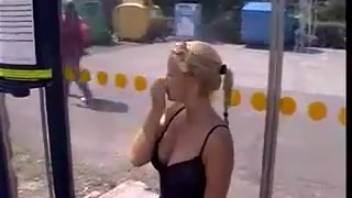 Gorgeous blond woman urinating on the public road