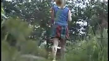 Busty chick peeing on a country lane